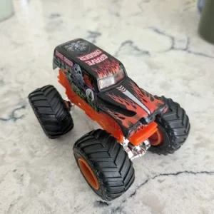 Orange grave digger monster truck. Collectable toy. Great condition. For kids.